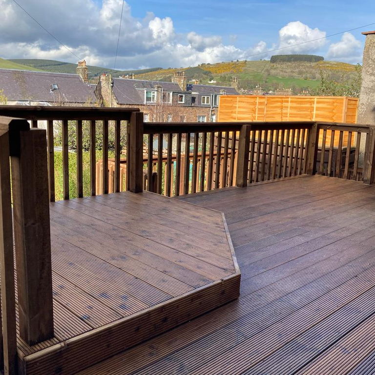 Custom outdoor decking and living space in Glasgow by BSM Contracts