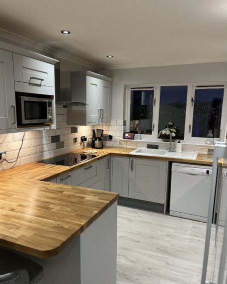 Shaker kitchen installation Glasgow with oak worktops and subway tiles
