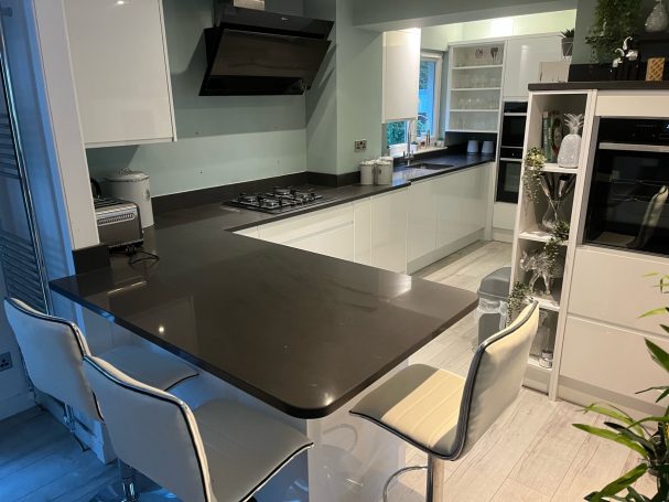 Modern gloss white kitchen installation Glasgow with black quartz worktop